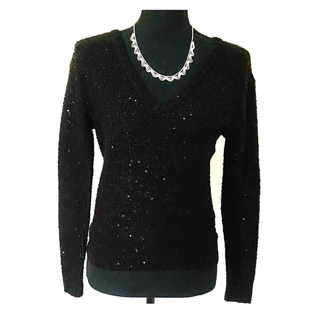 Shimmery light black sweater with a sheer back.